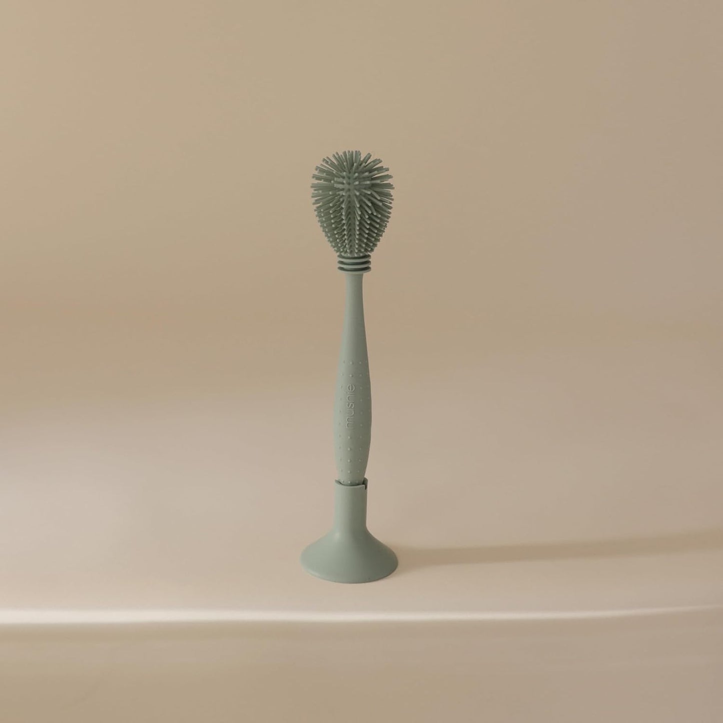 mushie Baby Bottle Brush | Soft Silicone with Suction Base (Shifting Sand)