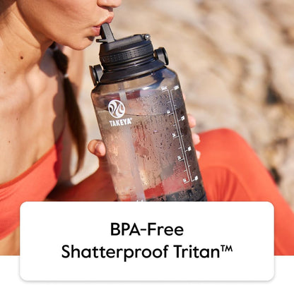 Takeya Motivational Water Bottle with Straw Lid and Time Marker (64 oz, Vivacity Purple) - Leakproof, BPA Free Water Bottle for Daily Intake Tracking