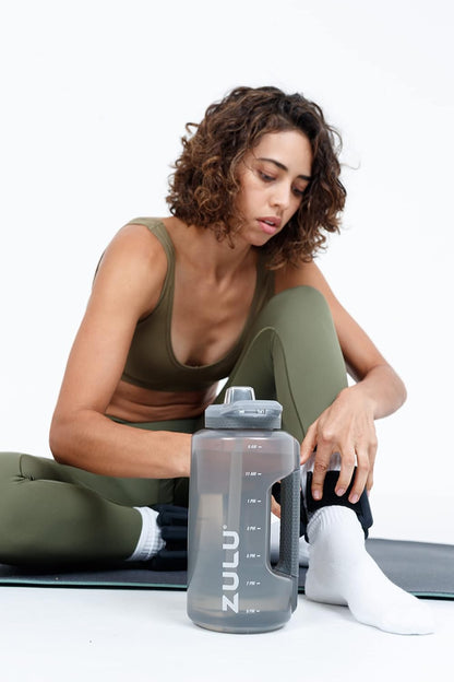 ZULU Goals 64oz Half Gallon Plastic Water Bottle with Straw and Time Marker | Large Reusable Jug with Handle and Leak Proof Lid for All Day Hydration, Gym and Outdoors, Gift Ready, Violet
